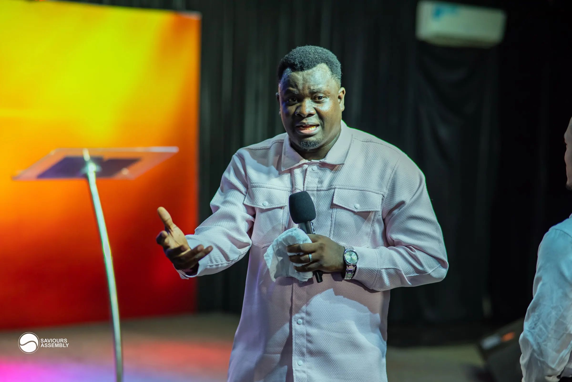 Church members smiling and connecting in a warm gathering space